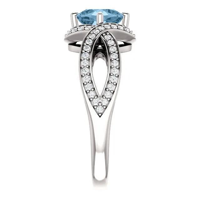 14KT GOLD 1.25 CT SKY BLUE TOPAZ & 1/3 CTW DIAMOND TWIST RING